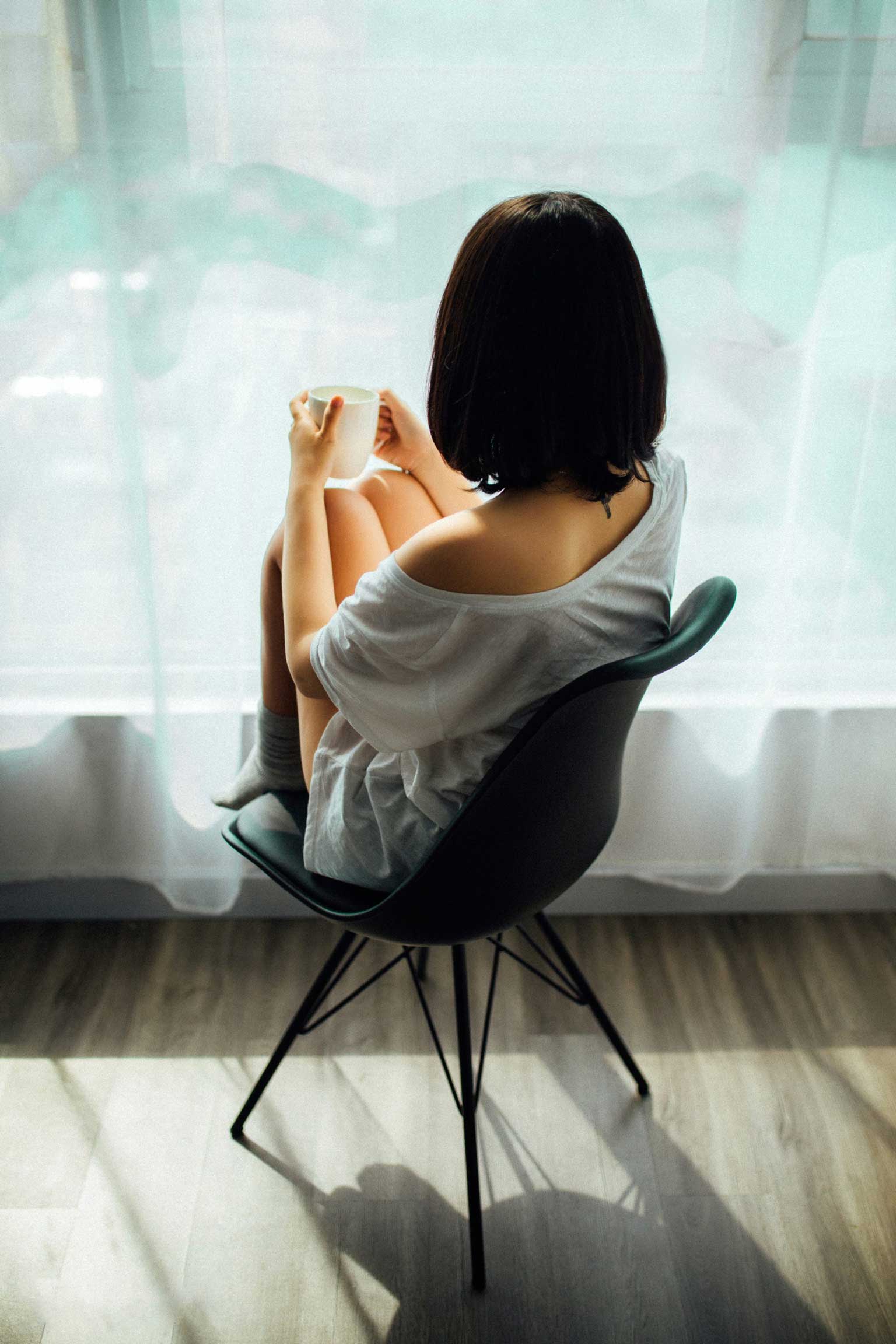 Woman relaxing in her living room